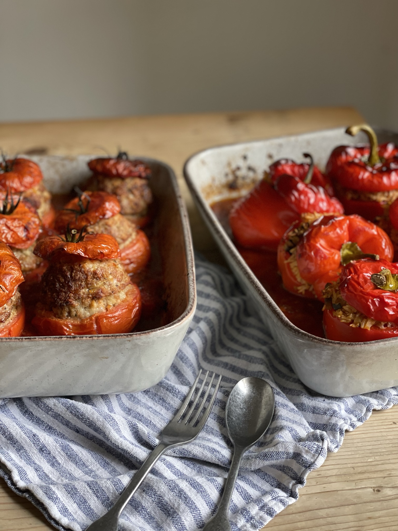 Provencal stuffed pepper and tomatoes - summer vegetables stuffed with herbed rice and beautifully seasoned pork, slow cooked in a rich tomato sauce